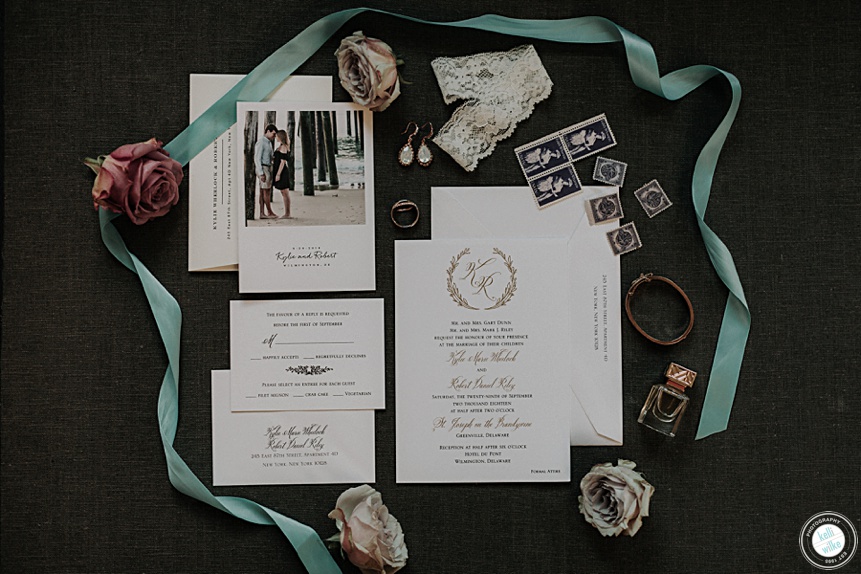 hotel dupont wedding invitation details with blue ribbon stamps, flowers, perfume and rings 
