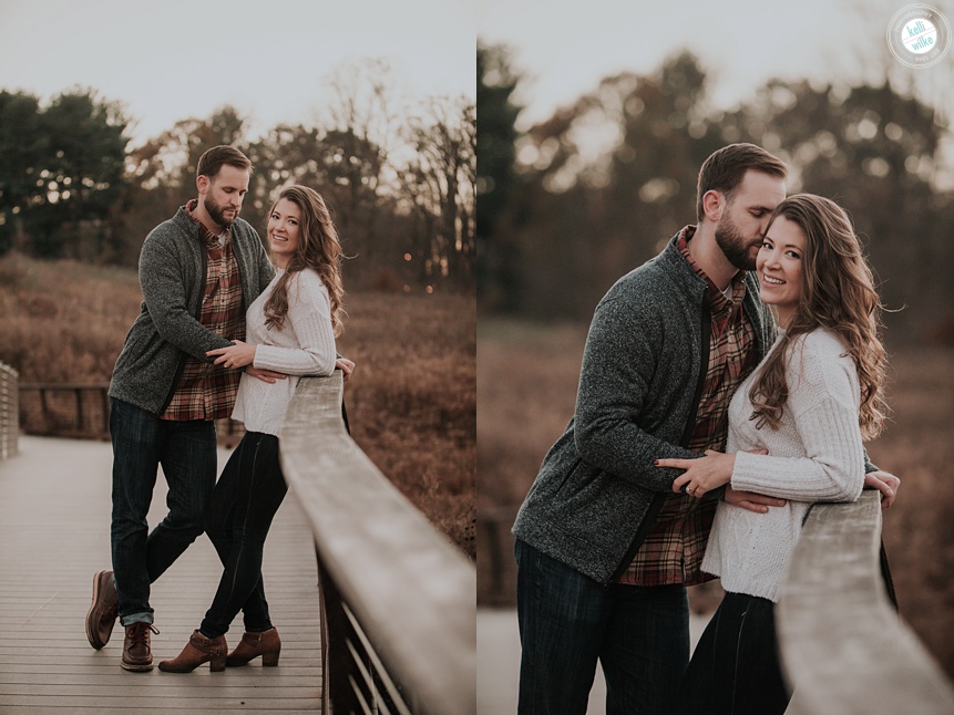 couple posing for their engagement photos on a bridge at Longwood Gardens in the fall
