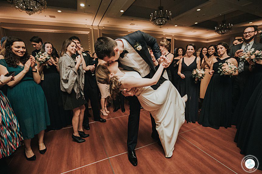 bride and groom dip at their first dance at their Logan Hotel wedding in philadelphia