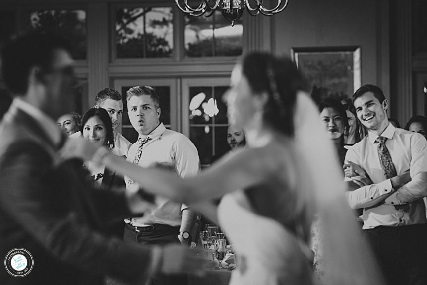 guests watch the bride and groom at their first dance at the deerfield country club wedding 