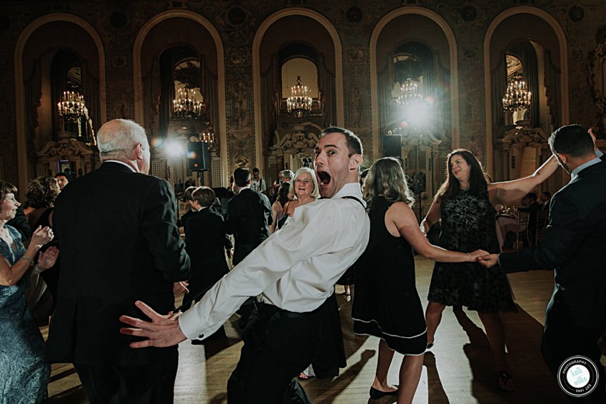 man dances to EBE Talent at a hotel dupont wedding reception