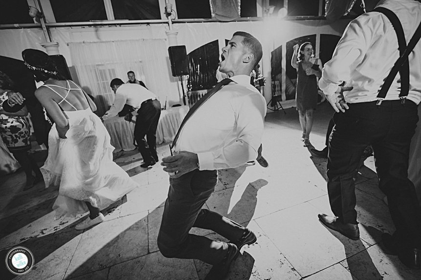 man dances at a wedding reception at Penn Oaks Golf club
