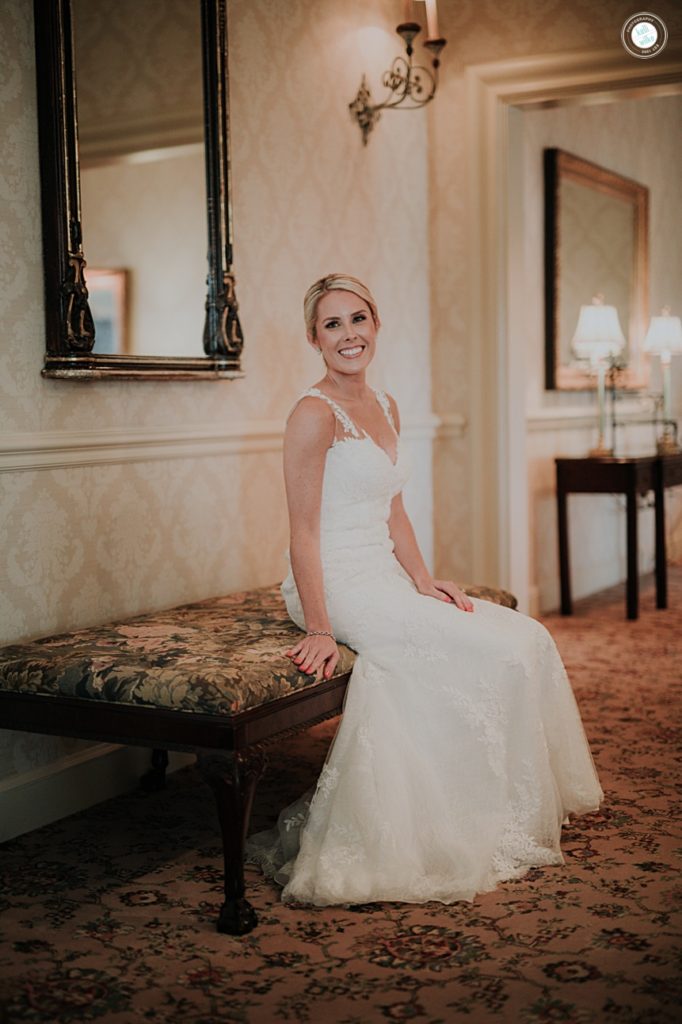 portrait of the bride sitting inside the Wilmington Country Club