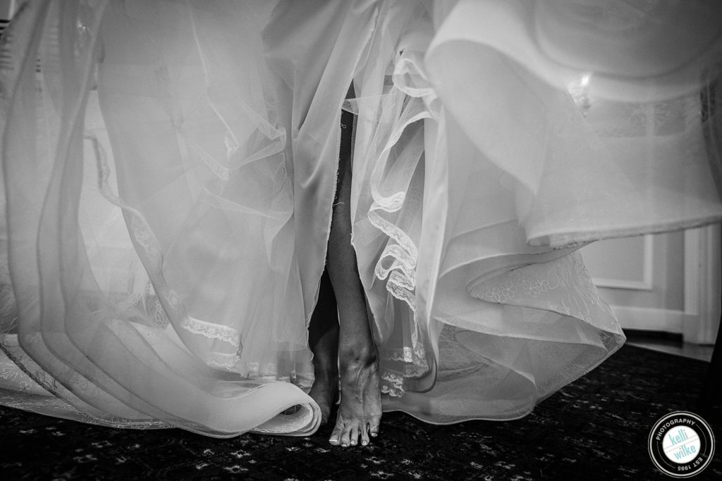detail of a bride putting her dress on in Wilmington Delaware 