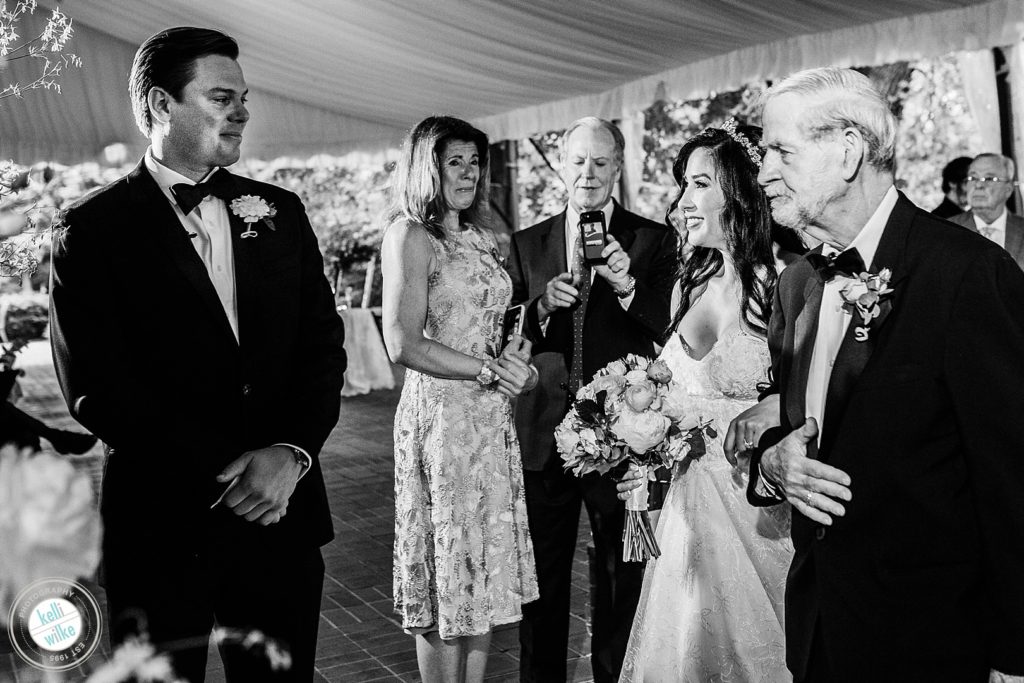 Father of the bride walks his daughter down the aisle at their Greenville Country Club in Greenville, DE