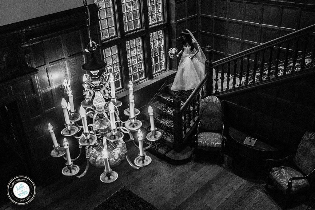 Bride walks down the stairs at Greenville Country Club in Greenville DE