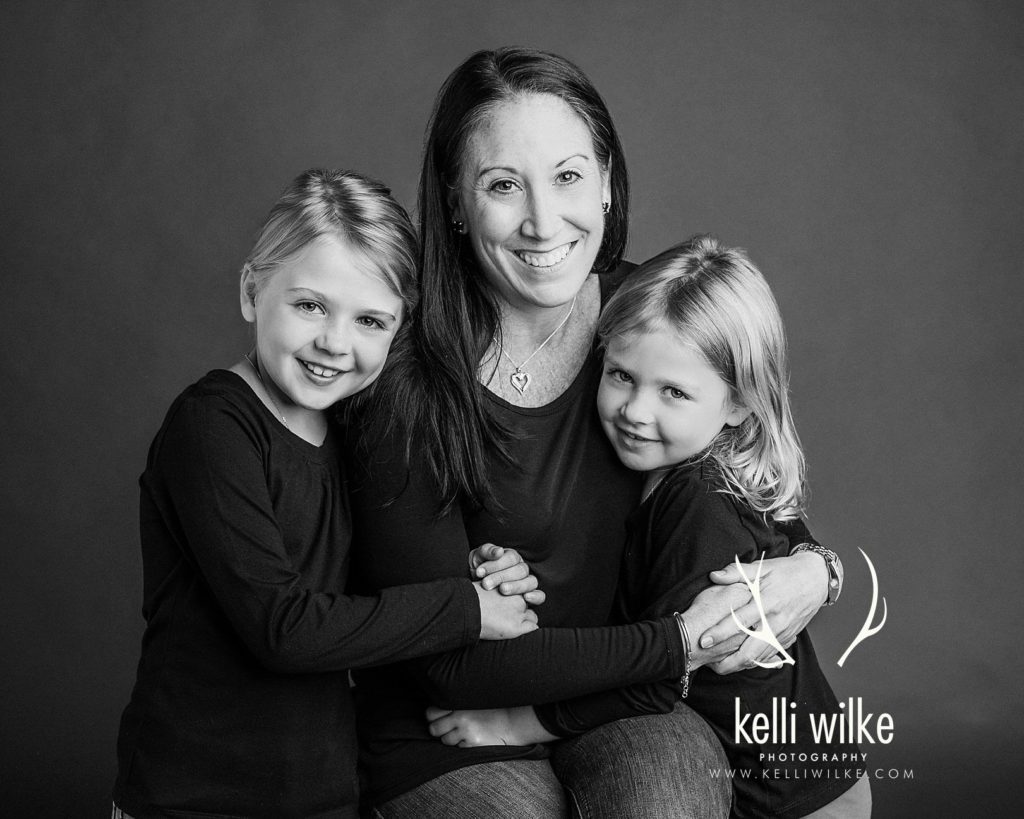 mother and her two daughters black and white portrait celebrating moms