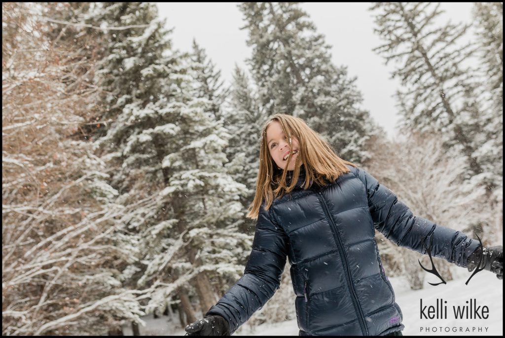girl in the snow in Wyoming