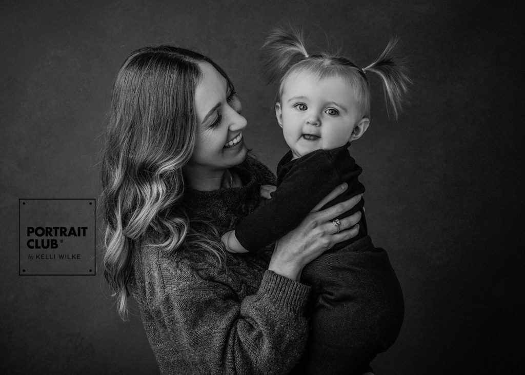 A candid portrait of a mother and her daughter from a family photo session with Kelli Wilke Photography. 